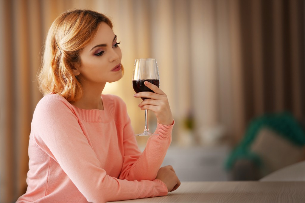 Is the alcohol in a glass of wine harmful to my breastfeeding baby?